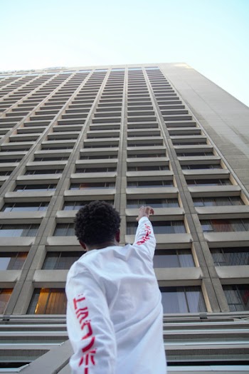 Man Pointing At A Building