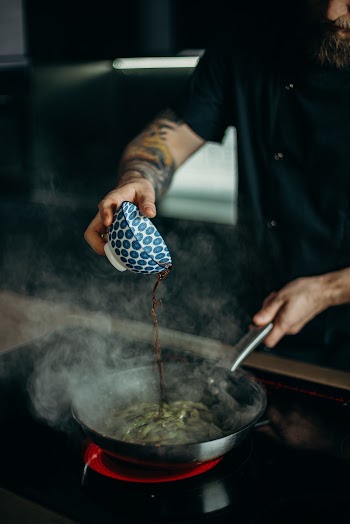 Man Pouring Soy Sauce