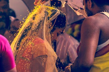 Man Pouring Woman Yellow Flowers