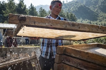 Man producing Lokta bark paper, | Free Photo - rawpixel