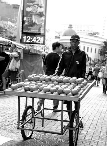 Man Pushing Fruit Stand