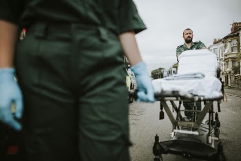 Man Pushing Hospital Bed