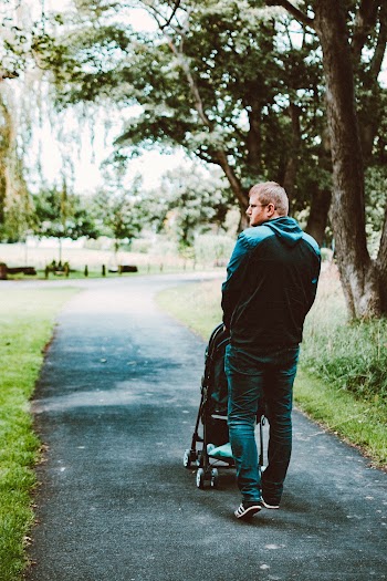 Man Pushing Stroller