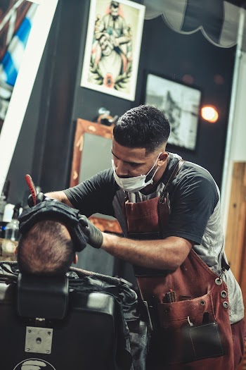 Man Putting Tattoo on the Person
