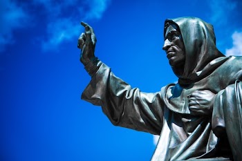 Man Raising Hand Statue