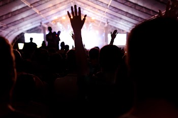 Man Raising His Hands Up