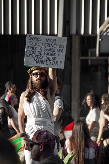 Man Raising White Signage