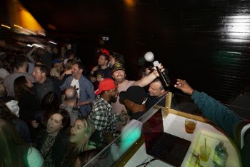 Man Reaching For Microphone