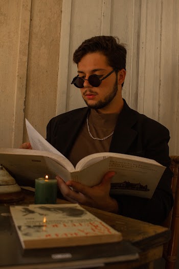 Man Reading Book Inside Room