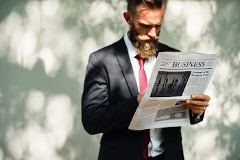man reading newspaper
