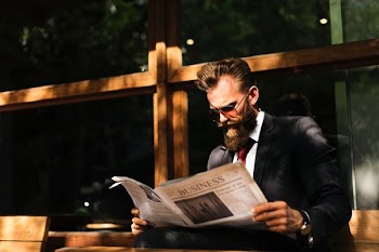 man reading newspaper