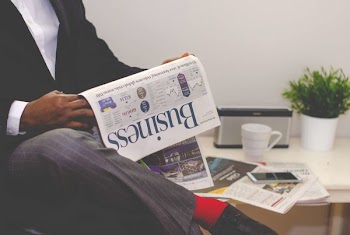          Man Reading Newspaper Free Photo     