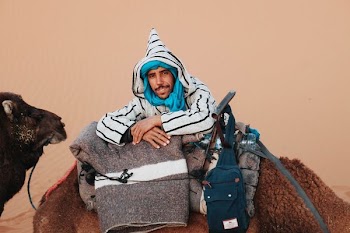 man ride on camel