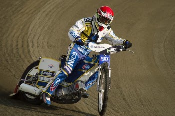 Man Rides Motorcycle on Race Track