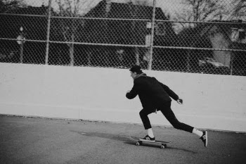 Man Riding a Skateboard in Black and White Photography · Free Stock Photo