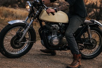 Man Riding Beige Naked Motorcycle