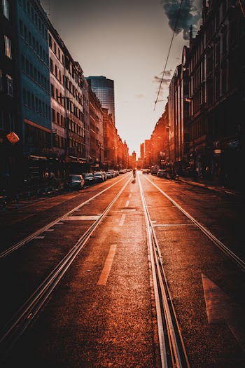 Man Riding Bicycle in the Middle of the Road