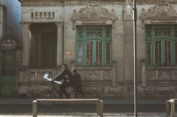 man riding bicycle on the street during daytime