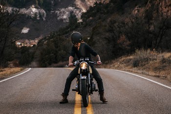 Man Riding Boxer Motorcycle on Road