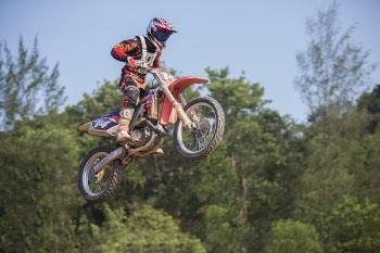 Man Riding Dirt Motorcycle