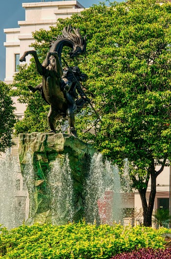 Man Riding Horse Statue