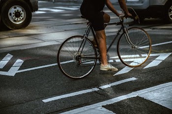 Man Riding In City Bike Lane