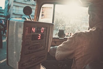 man riding in vehicle