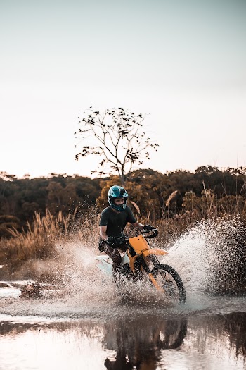 Man Riding Motocross Dirt Bike