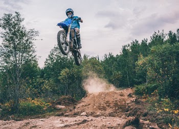 Man Riding Motocross Dirt Bike