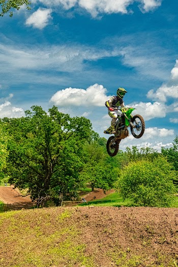 Man Riding Motocross Dirt Bike