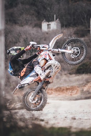 Man Riding Motocross Dirt Bike