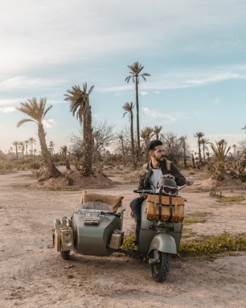 Man Riding Motorcycle With Sidecar 