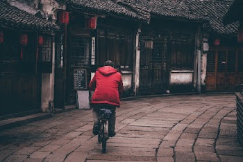 Man Riding on Bicycle