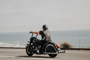 man riding on black motorcycle