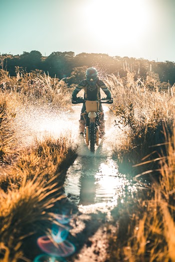Man Riding on Dirk Bike on Water