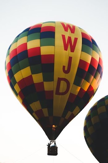 man riding on hot air balloon