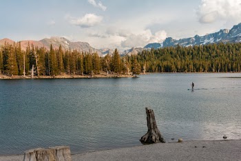 Man Riding on Paddle Board 