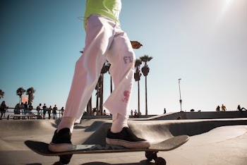 Man Riding on Skateboard Deck