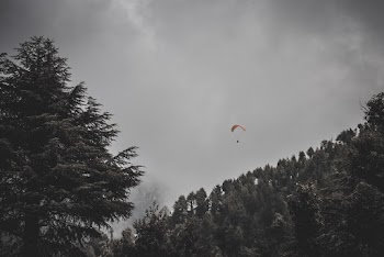 Man Riding Parachute