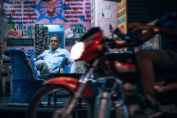 man riding red motorcycle