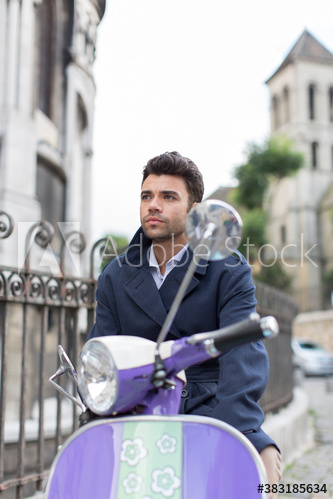 Man riding scooter, Paris, France