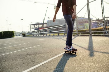 Man Riding Skateboard Near on Bridge