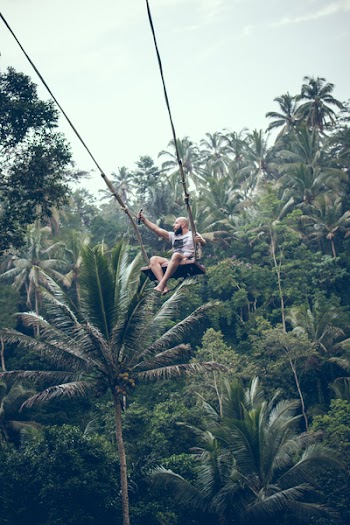Man Riding Swing