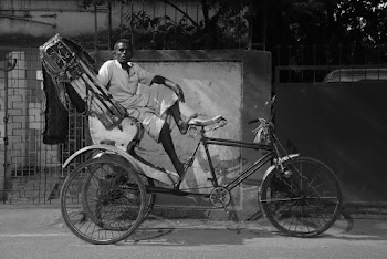 Man Riding Trike With Carriage
