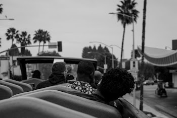 Man Riding Vehicle Grayscale Photo