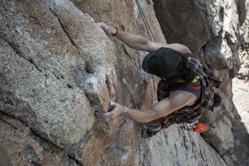 man rock climbing