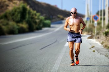 Man Running Beside Street
