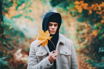man's brown and black hooded jacket