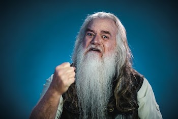 Man Shakes Fist At Camera