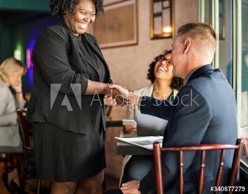 Man shaking hands with the lady